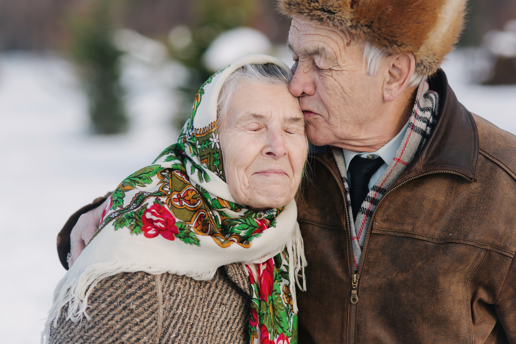 Elderly Man Kissing His Wife  