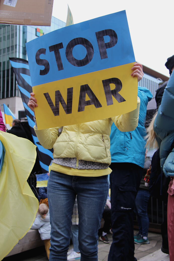 A Person Holding a Stop War Poster during a Peaceful Protest